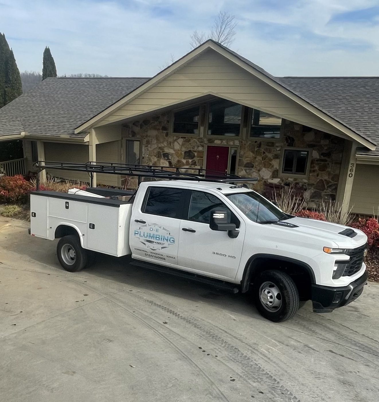 DE Plumbing truck parked outside a customer's home — DE Plumbing, Cincinnati