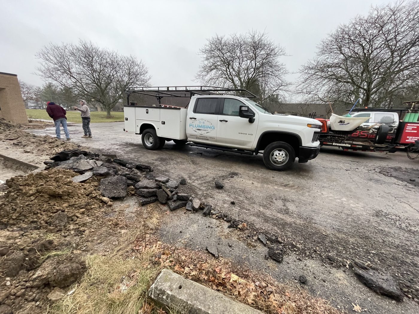 Water main excavation and repair in a front yard — DE Plumbing, Cincinnati