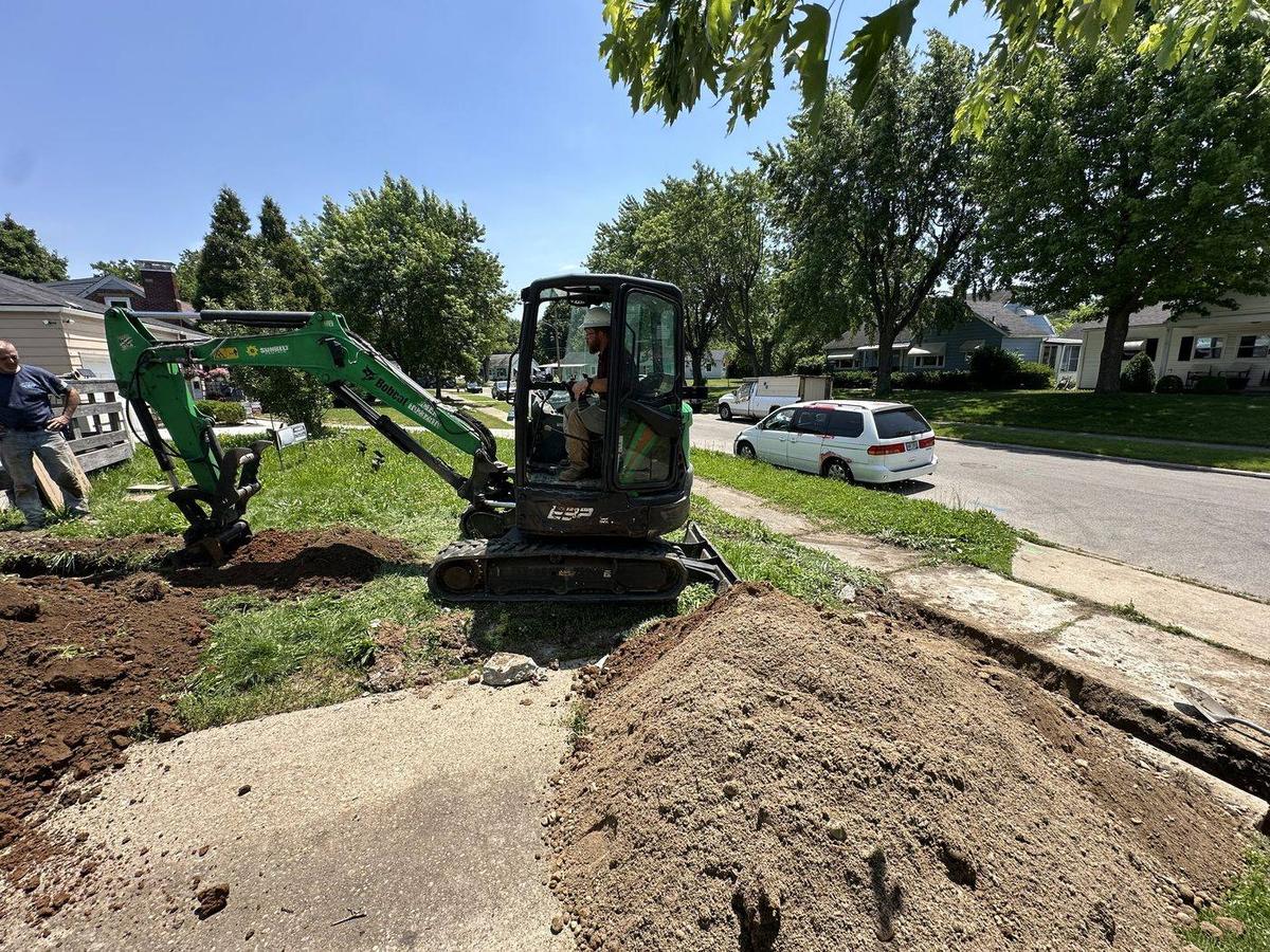 Mini-excavator digging for a sewer line replacement — DE Plumbing, Cincinnati